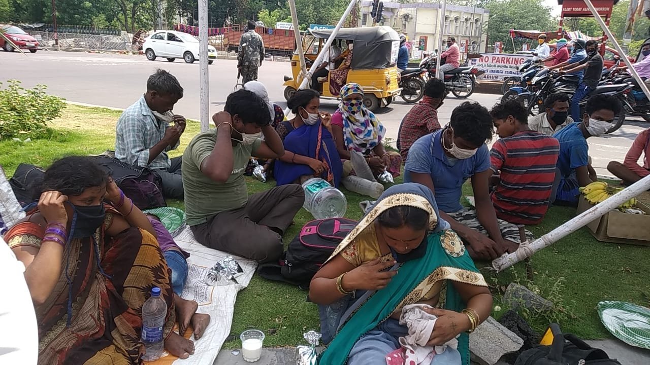 Families resting together at a relief gathering