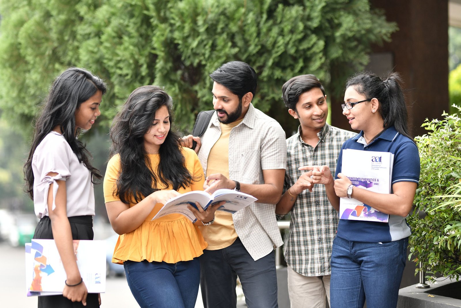 Young volunteers studying together on steps